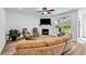 Cozy living room with a fireplace, a flat-screen TV, and views of the backyard at 178 Sunshower Rdg, Canton, GA 30114