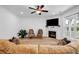 Living room featuring a fireplace, a flat-screen TV, and views of the backyard at 178 Sunshower Rdg, Canton, GA 30114