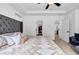 Spacious main bedroom features a king bed, neutral colors, and access to a private bath and closet at 178 Sunshower Rdg, Canton, GA 30114