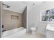 Bright bathroom with stylish tilework, modern fixtures, and a combined tub and shower at 1870 Avon Sw Ave, Atlanta, GA 30311