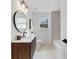 Bathroom features a stylish vanity, modern fixtures, and a bright window view at 1870 Avon Sw Ave, Atlanta, GA 30311