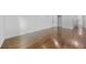 Large bedroom showcasing gleaming hardwood floors and access to other rooms at 1870 Avon Sw Ave, Atlanta, GA 30311