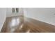 Bright bedroom showcasing beautiful hardwood floors and a window with outdoor views at 1870 Avon Sw Ave, Atlanta, GA 30311
