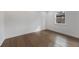 Inviting bedroom featuring polished hardwood floors and a sunlit window at 1870 Avon Sw Ave, Atlanta, GA 30311
