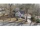Charming home featuring a red door, complemented by a lush yard and a freshly paved driveway at 1870 Avon Sw Ave, Atlanta, GA 30311