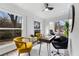 Bright sun room with lots of windows, painted brick and wood floors at 1870 Avon Sw Ave, Atlanta, GA 30311