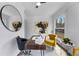 Bright sun room with lots of windows, painted brick and wood floors and modern art at 1870 Avon Sw Ave, Atlanta, GA 30311