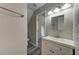 Bathroom features a vanity, toilet, shower and view to a bedroom at 23 Club Dr, Locust Grove, GA 30248