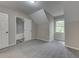 Bedroom features plush gray carpet, window and ensuite bathroom at 23 Club Dr, Locust Grove, GA 30248