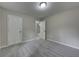 Bright bedroom showcasing neutral walls, carpet flooring, and a double door closet at 23 Club Dr, Locust Grove, GA 30248