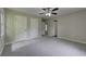 Large bedroom with neutral walls, new carpet, and multiple closets offering ample storage at 23 Club Dr, Locust Grove, GA 30248