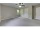 Spacious bedroom featuring neutral walls, new carpet, large windows, and ample closet space at 23 Club Dr, Locust Grove, GA 30248