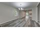 Spacious dining area with modern floors and chandelier at 23 Club Dr, Locust Grove, GA 30248