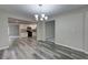 Open dining room view into kitchen with stainless steel appliances at 23 Club Dr, Locust Grove, GA 30248