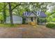 Charming home featuring light blue siding, dormer windows, and a welcoming front porch at 23 Club Dr, Locust Grove, GA 30248