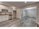 Open kitchen area with stainless steel dishwasher and view of dining room at 23 Club Dr, Locust Grove, GA 30248