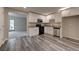 Updated kitchen with white cabinets, granite countertops, and stainless steel appliances at 23 Club Dr, Locust Grove, GA 30248