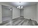Inviting living room showcasing modern gray flooring and neutral color scheme at 23 Club Dr, Locust Grove, GA 30248