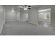 Spacious living room flows into the dining area that features hardwood floors and plenty of natural light at 23 Club Dr, Locust Grove, GA 30248