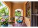 Relaxing balcony featuring terracotta tile flooring, garden views, and wicker chair at 297 Atlanta Se Ave # 8, Atlanta, GA 30315