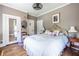 Spacious bedroom with hardwood floors, multiple closets, and a decorative mirror at 297 Atlanta Se Ave # 8, Atlanta, GA 30315