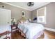 Inviting bedroom with hardwood floors, ceiling fan, and a comfortable bed with decorative pillows at 297 Atlanta Se Ave # 8, Atlanta, GA 30315