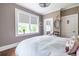 Bright bedroom with hardwood floors, windows with sun-blocking shades, and neutral color scheme at 297 Atlanta Se Ave # 8, Atlanta, GA 30315