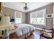 Cozy bedroom with hardwood floors, large windows, and a comfortable bed at 297 Atlanta Se Ave # 8, Atlanta, GA 30315
