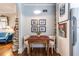 Charming dining area off kitchen with dark wood table, seating for two, and decorative artwork at 297 Atlanta Se Ave # 8, Atlanta, GA 30315