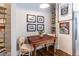 Cozy dining nook adjacent to kitchen featuring a rustic table, unique chairs, and shelving at 297 Atlanta Se Ave # 8, Atlanta, GA 30315