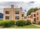 Stucco apartment building with arched balconies and lush green landscaping provides a charming curb appeal at 297 Atlanta Se Ave # 8, Atlanta, GA 30315