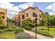 Charming stucco apartment building with wrought iron fencing and professionally landscaped yard at 297 Atlanta Se Ave # 8, Atlanta, GA 30315