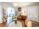 Open living room layout with hardwood floors and arched doorway leading to kitchen at 297 Atlanta Se Ave # 8, Atlanta, GA 30315