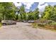 Parking lot with multiple cars parked next to garden beds and landscaping at 297 Atlanta Se Ave # 8, Atlanta, GA 30315