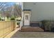 View of a wooden deck and fenced backyard with grass at 958 Austin Ne Ave, Atlanta, GA 30307
