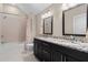 Bright bathroom with double vanity, granite countertops and a shower/tub combo at 958 Austin Ne Ave, Atlanta, GA 30307