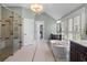 The bathroom features an elegant tub, glass shower, and large windows at 958 Austin Ne Ave, Atlanta, GA 30307