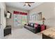 Bedroom featuring a mounted TV, comfortable seating, and a neutral color palette at 958 Austin Ne Ave, Atlanta, GA 30307