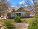 Charming two-story home with a well-manicured lawn and inviting curb appeal, surrounded by trees at 958 Austin Ne Ave, Atlanta, GA 30307