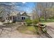 Charming home exterior with a porch, landscaping, and mature trees at 958 Austin Ne Ave, Atlanta, GA 30307