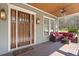Inviting front porch with stylish seating, warm lighting, and a comfortable outdoor living space at 958 Austin Ne Ave, Atlanta, GA 30307