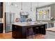 Spacious kitchen with white cabinets, stainless steel appliances, and a center island at 958 Austin Ne Ave, Atlanta, GA 30307