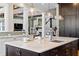 Open kitchen boasts a large island with seating, stainless appliances and a view of the living room at 958 Austin Ne Ave, Atlanta, GA 30307