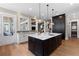 Open kitchen features a large center island, stainless steel appliances, and opens to the living area at 958 Austin Ne Ave, Atlanta, GA 30307