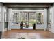 Spacious living room opens to a screened porch, offering seamless indoor-outdoor living at 958 Austin Ne Ave, Atlanta, GA 30307