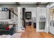 Elegant living room with hardwood floors seamlessly transitions to the kitchen and outdoor spaces at 958 Austin Ne Ave, Atlanta, GA 30307