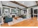 Open-concept living room with hardwood floors, a fireplace, comfortable seating, and a view of the staircase at 958 Austin Ne Ave, Atlanta, GA 30307