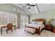 Vaulted ceilings and natural light make the main bedroom feel open and bright at 958 Austin Ne Ave, Atlanta, GA 30307