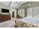Light-filled main bedroom with vaulted ceilings and exterior views at 958 Austin Ne Ave, Atlanta, GA 30307