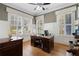 Well-lit home office with hardwood floors and built-in shelving at 958 Austin Ne Ave, Atlanta, GA 30307